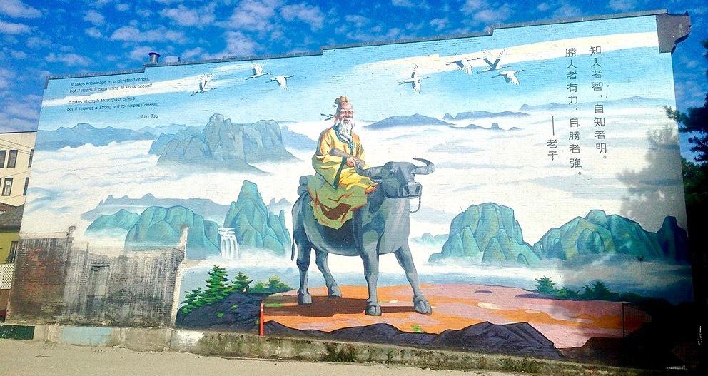 A mural of Laozi riding a water bufflo