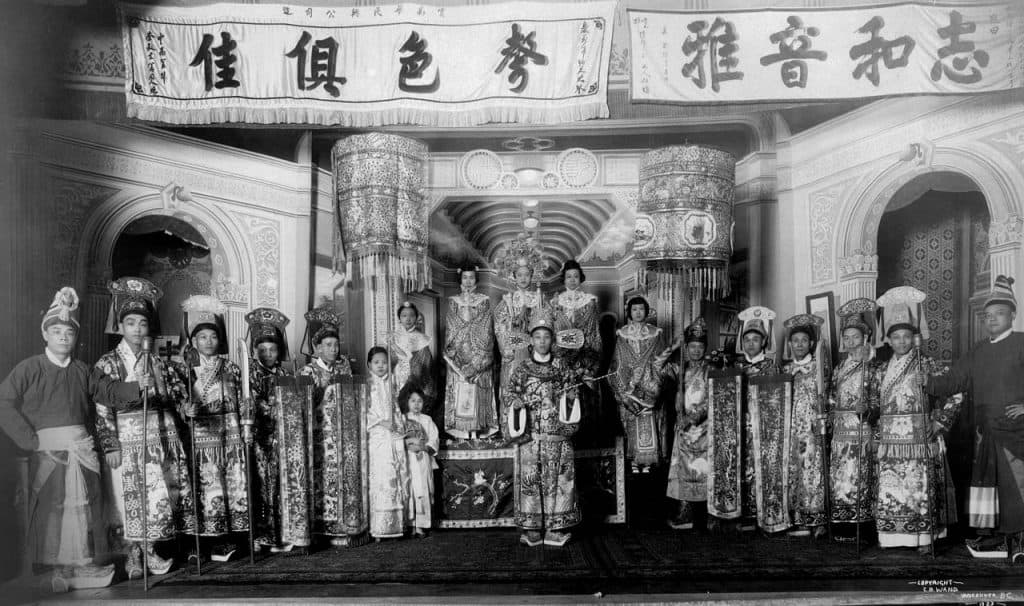 Sing Ping Columbia-Theatre - archival picture of Cantonese opera. Group of Chinese opera singers in costume standing.